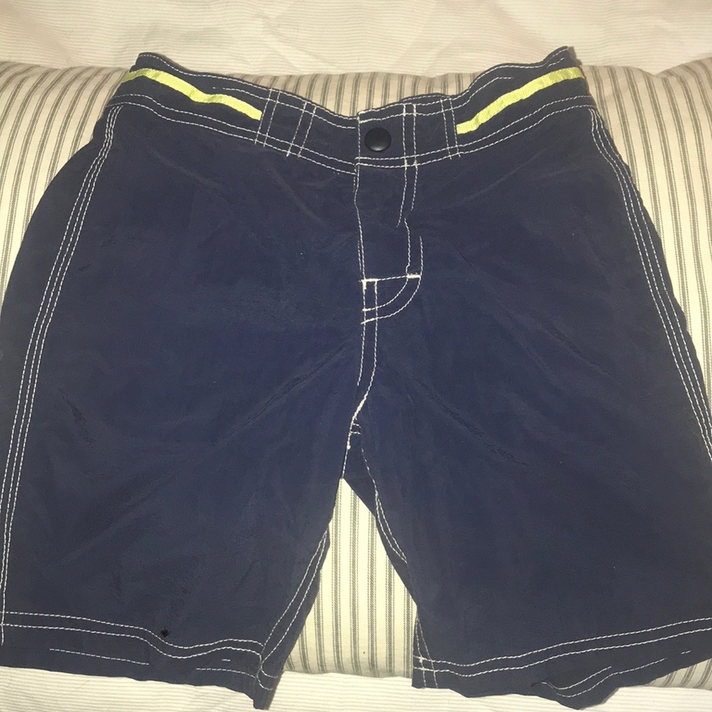 Lot of J Crew swim trunks. Used condition, faded.